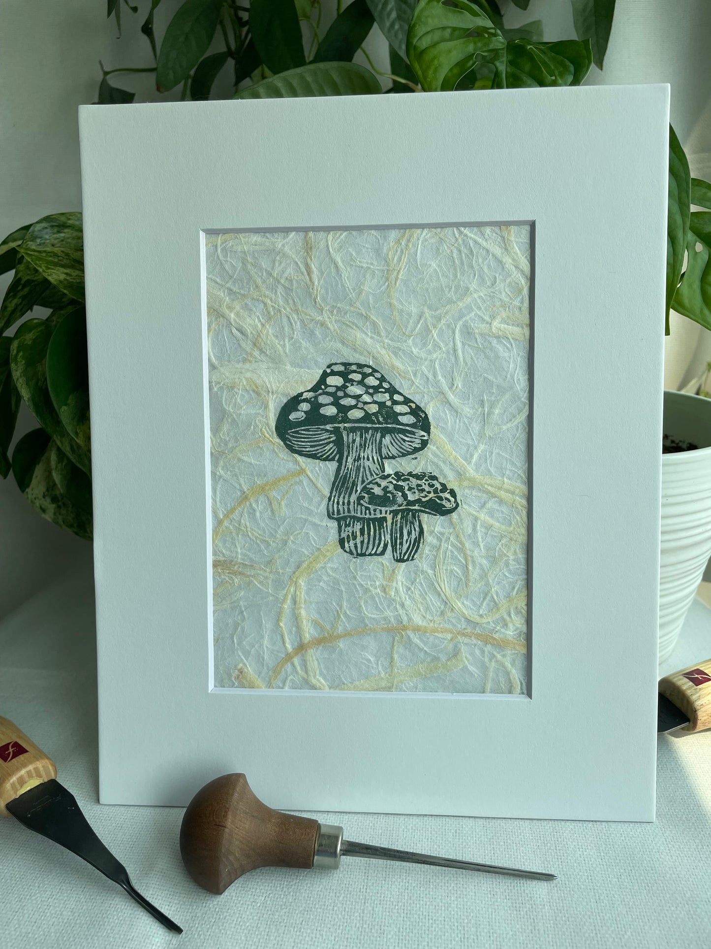 Mini Mush linocut printed on handmade plant fiber paper matted to 8x10”