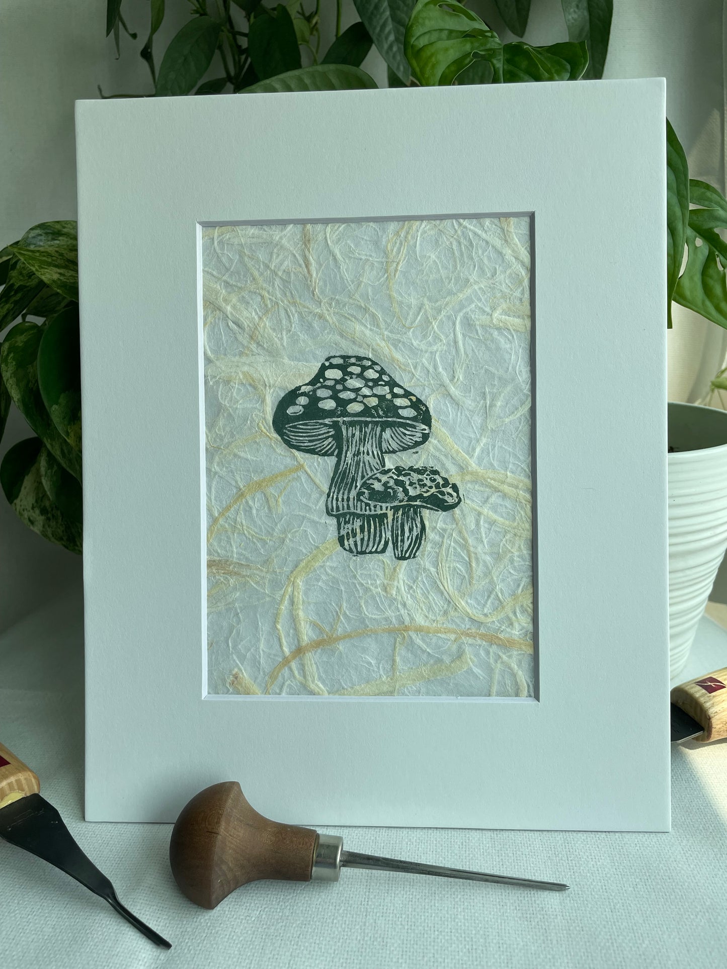 Mini Mush linocut printed on handmade plant fiber paper matted to 8x10”