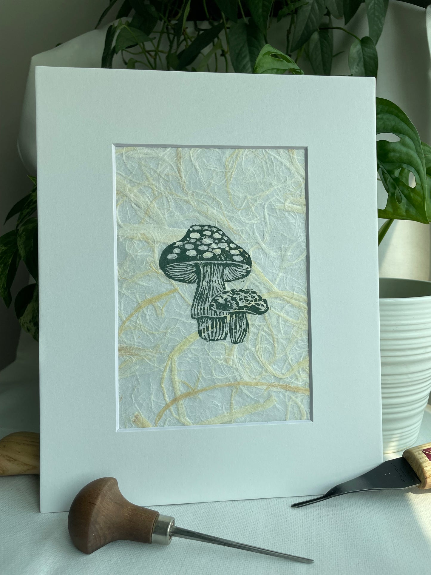 Mini Mush linocut printed on handmade plant fiber paper matted to 8x10”